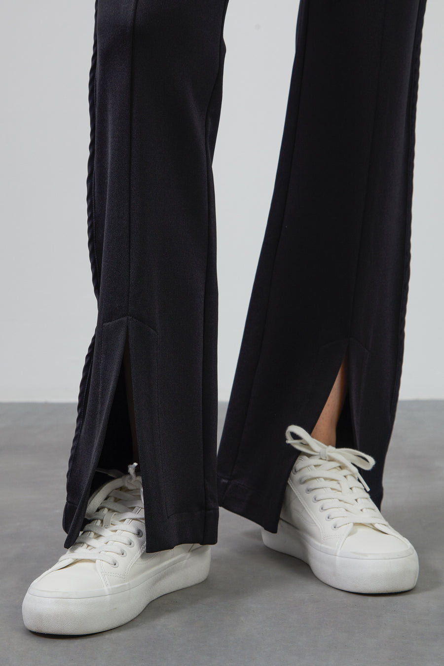 Black Flare Pants With Waist Tie Detail And Front Slits