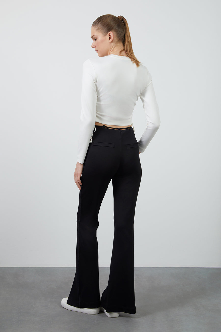 Black Flare Pants With Waist Tie Detail And Front Slits